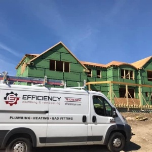 company van in front of house thats being built
