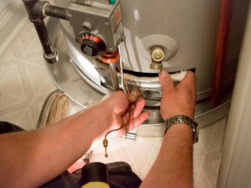 Plumber Performing Water Heater Service in Hanover, MA